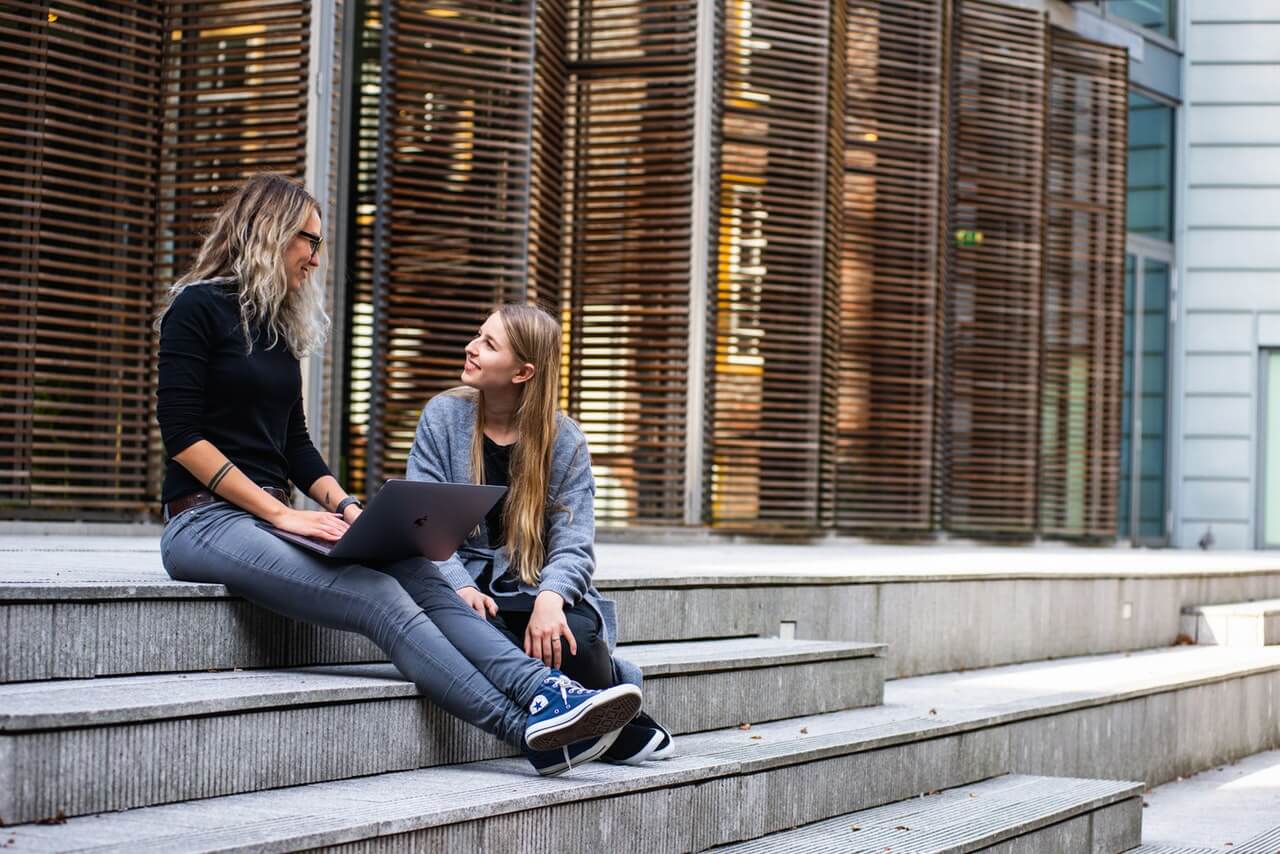 girls sitting on steps