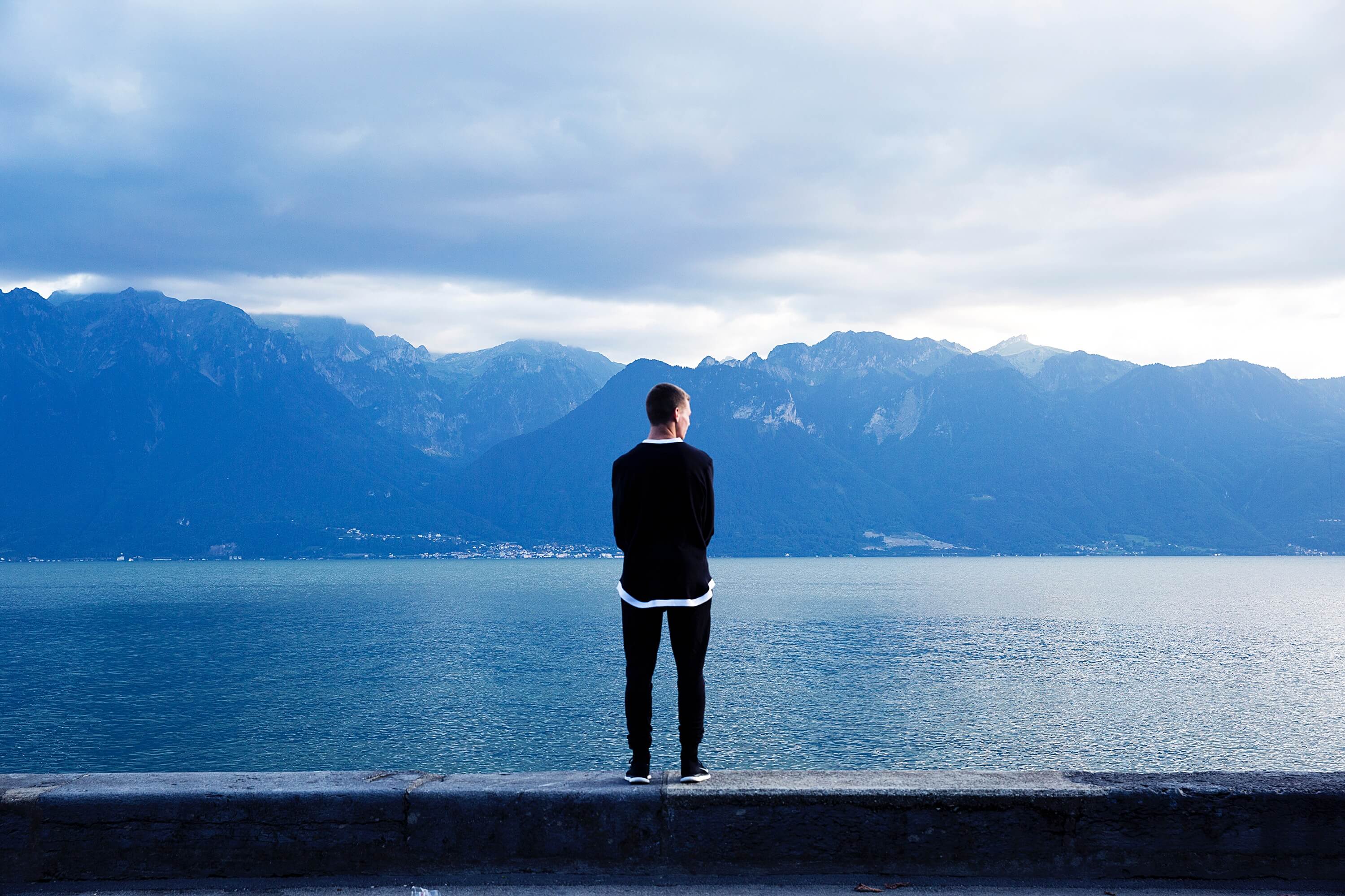 man looking at water