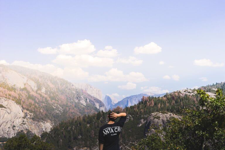 man looking at mountain