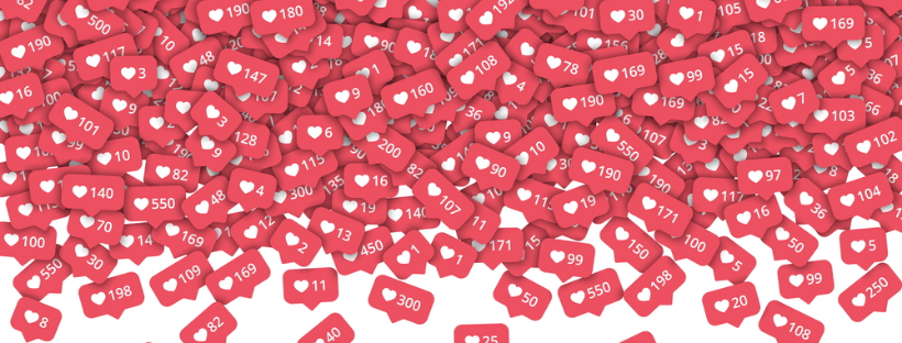 A large collection of red notification icons with white hearts and various numbers, symbolizing social media likes, densely overlapping each other, representing the effectiveness of a social media scheduler | plannthat.com