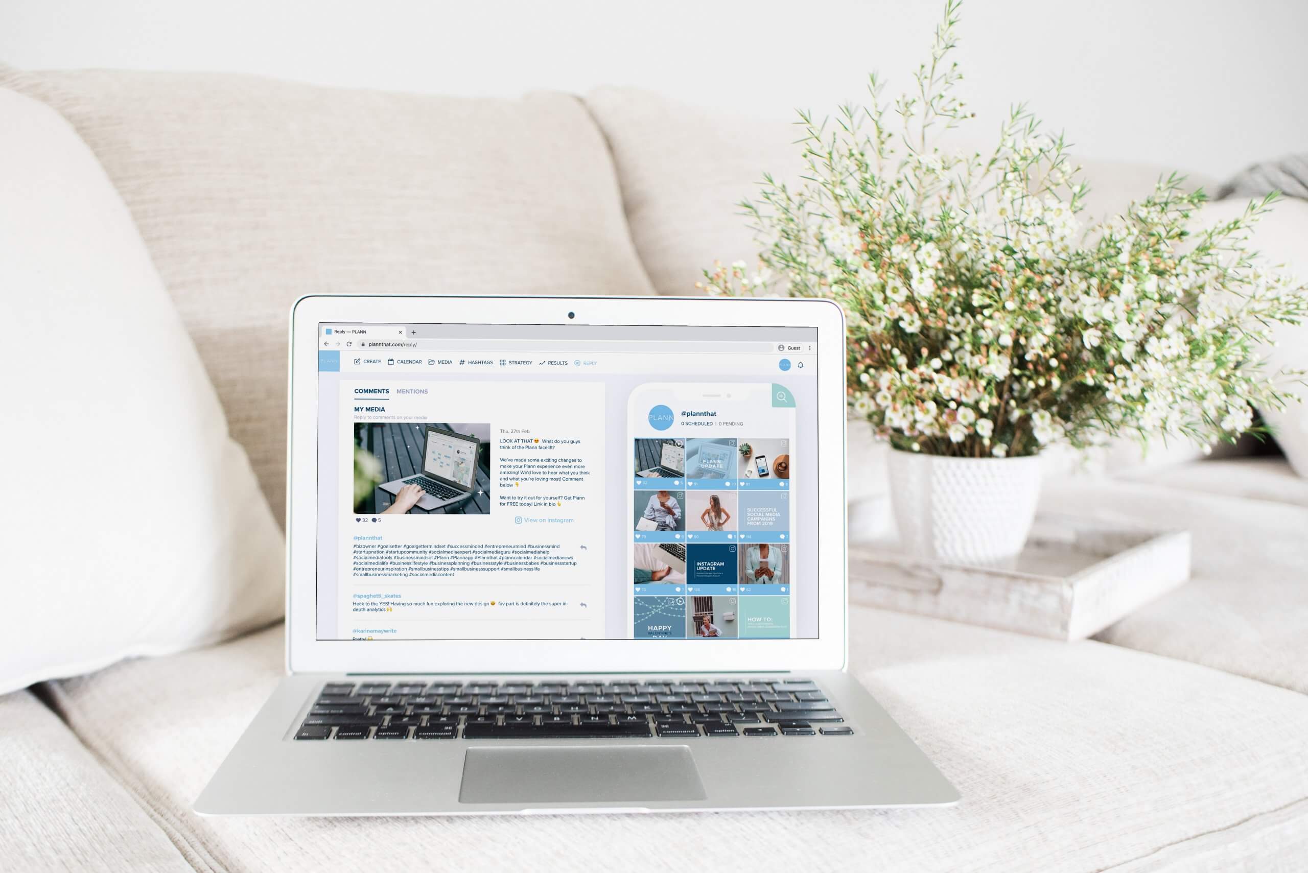 A laptop displaying a website screen on a beige couch with a potted plant in the background, creating a cozy work-from-home setup, ideal for using a social media scheduler | plannthat.com
