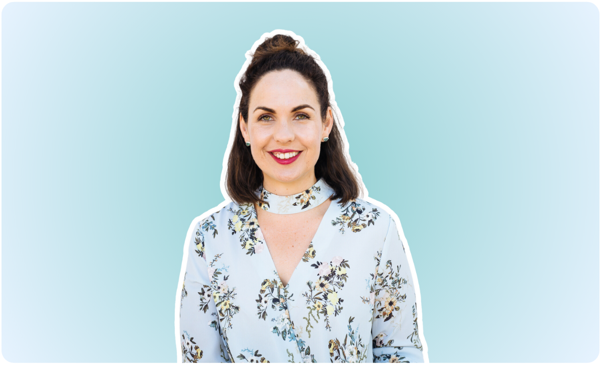 A woman with dark hair in a top knot hairstyle, wearing a floral blouse, smiles against a light blue background with rounded corners, exuding a bright and cheerful tone | Social media planner | plannthat.com