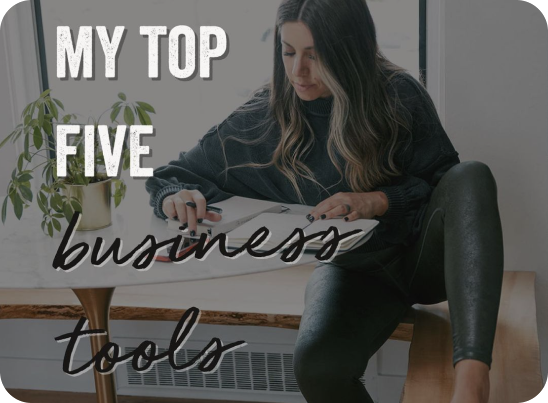 A woman sitting and writing in a notebook with text overlay "My Top Five Business Tools" and a potted plant on the table, highlighting the use of a social media planner | plannthat.com