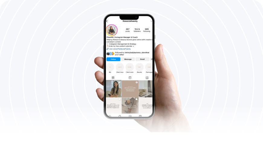 A hand holding a smartphone displaying an Instagram profile with the username "thesocialtwenty," showing 467 posts, 18.2K followers, and 589 following, with options to Follow, Message, and Email visible | Social media scheduler | plannthat.com